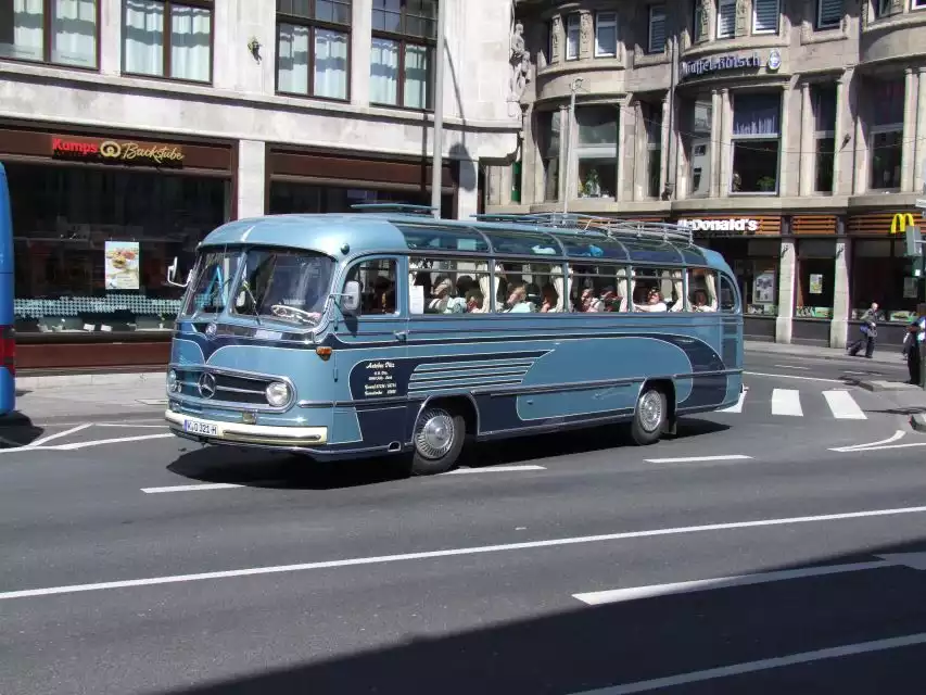 Cologne: Nostalgic Tour in German in Vintage Bus | GetYourGuide