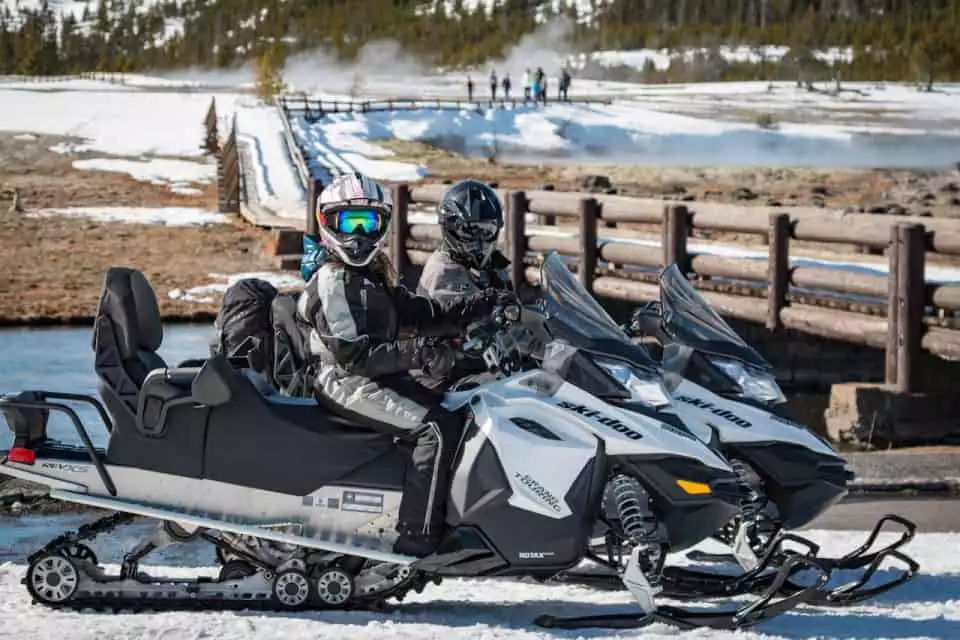 Jackson: Private Yellowstone Snowmobile Tour to Old Faithful | GetYourGuide